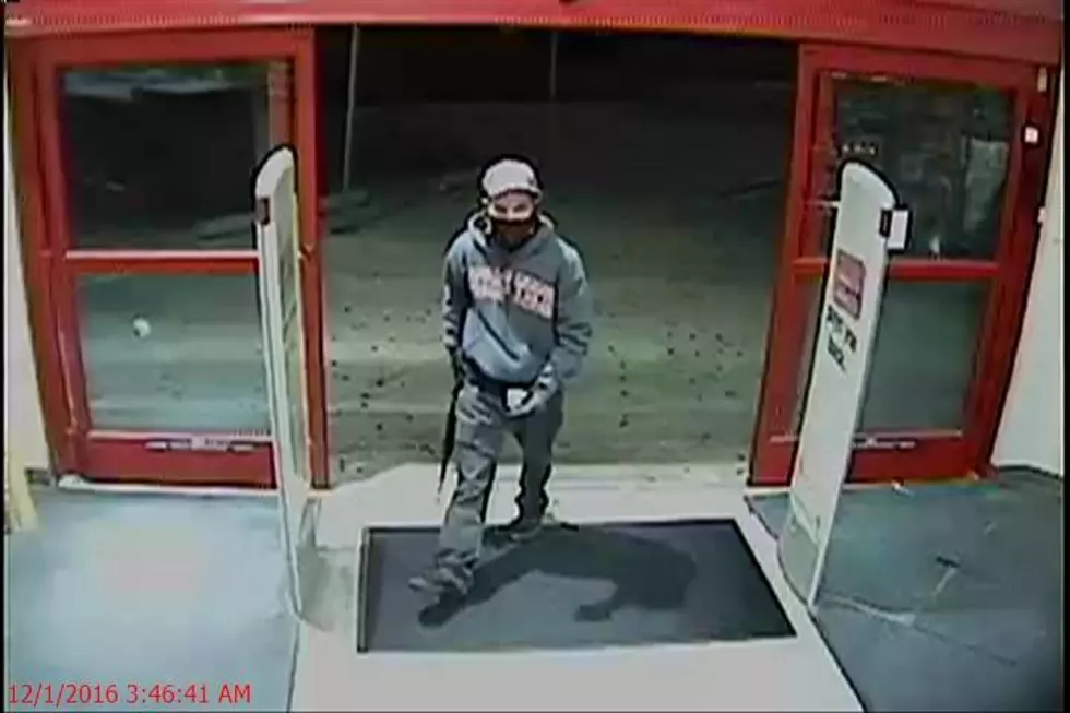 Man With Cross Tattoo on His Face Uses Rifle to Rob CVS Store